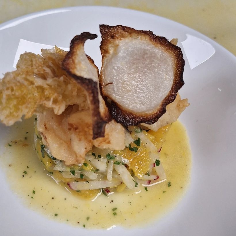 Roast pork loin with a crisp tuile and a butter sauce